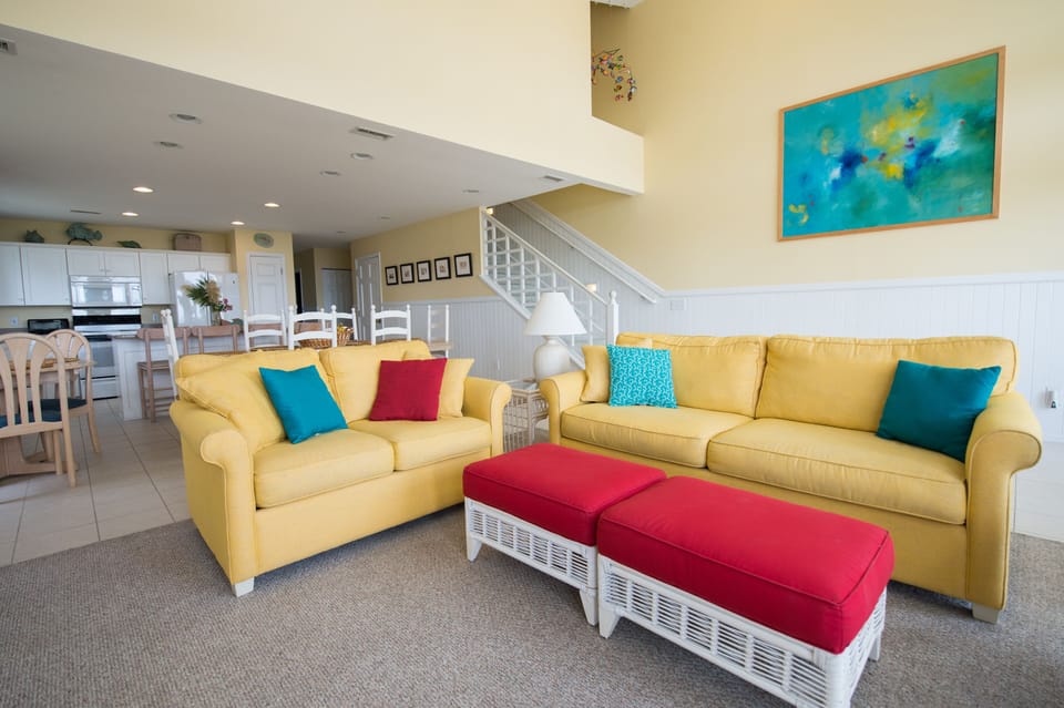 living room (now has navy blue sectional sofa)