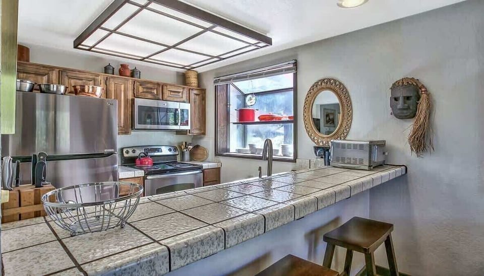 Inviting kitchen with breakfast bar seating and open space perfect for casual dining.