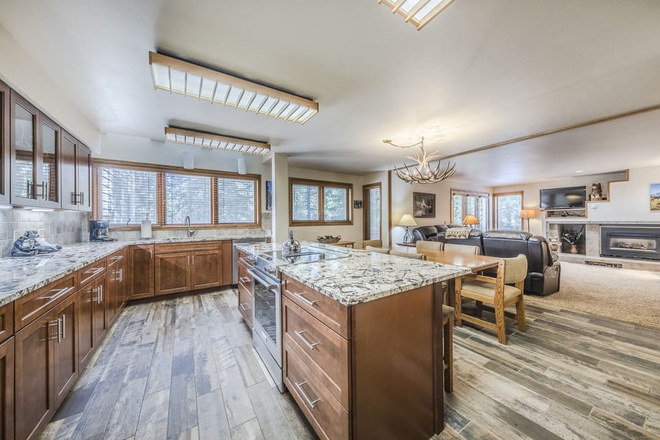 Kitchen - Beautifully updated space with granite counters, new cabinetry, and new floors.