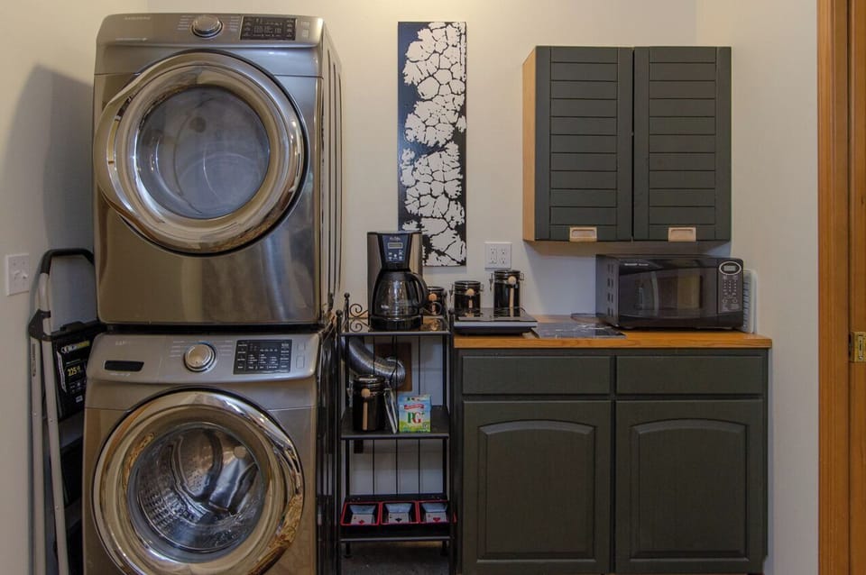 Part of kitchen - shown: microwave, induction burner(s), coffee maker.