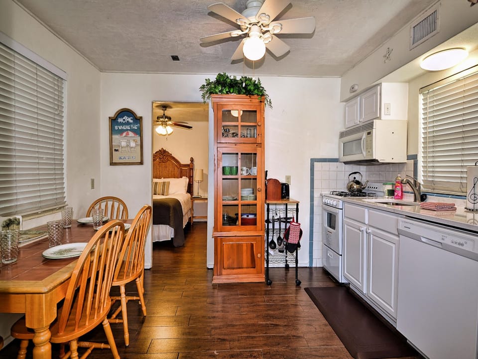 Bedroom is off the kitchen.