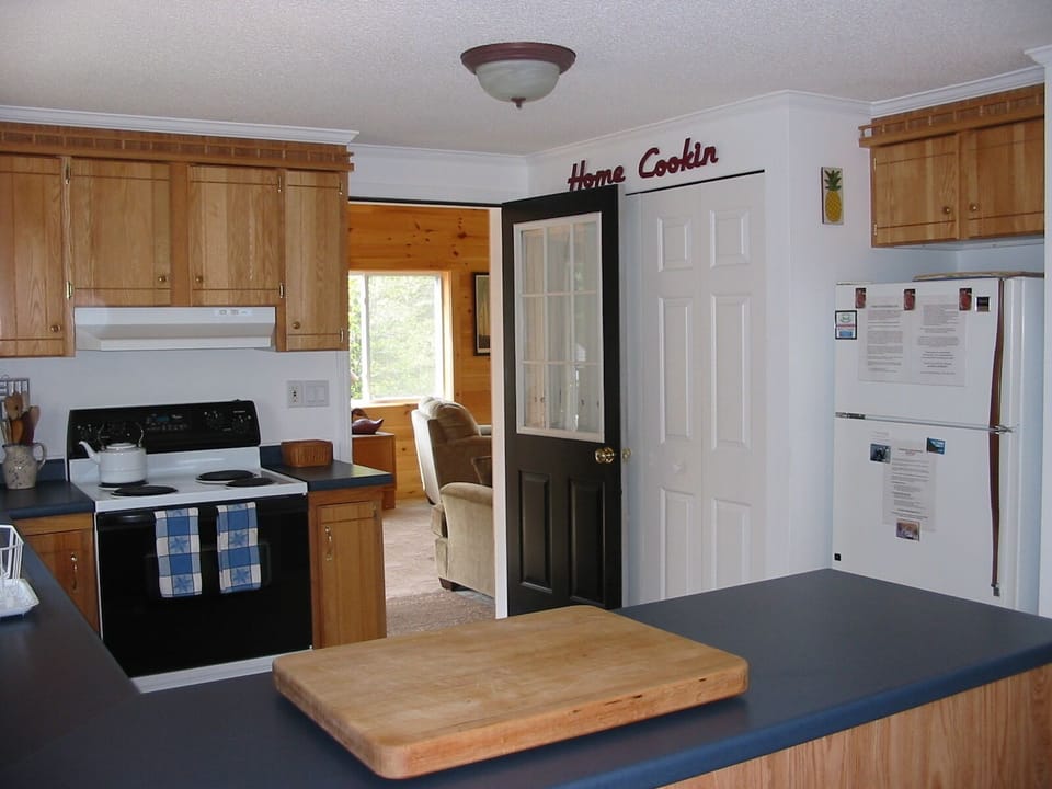 Laundry Closet with Full-Size Washer and Dryer is Located Behind Kitchen Door!