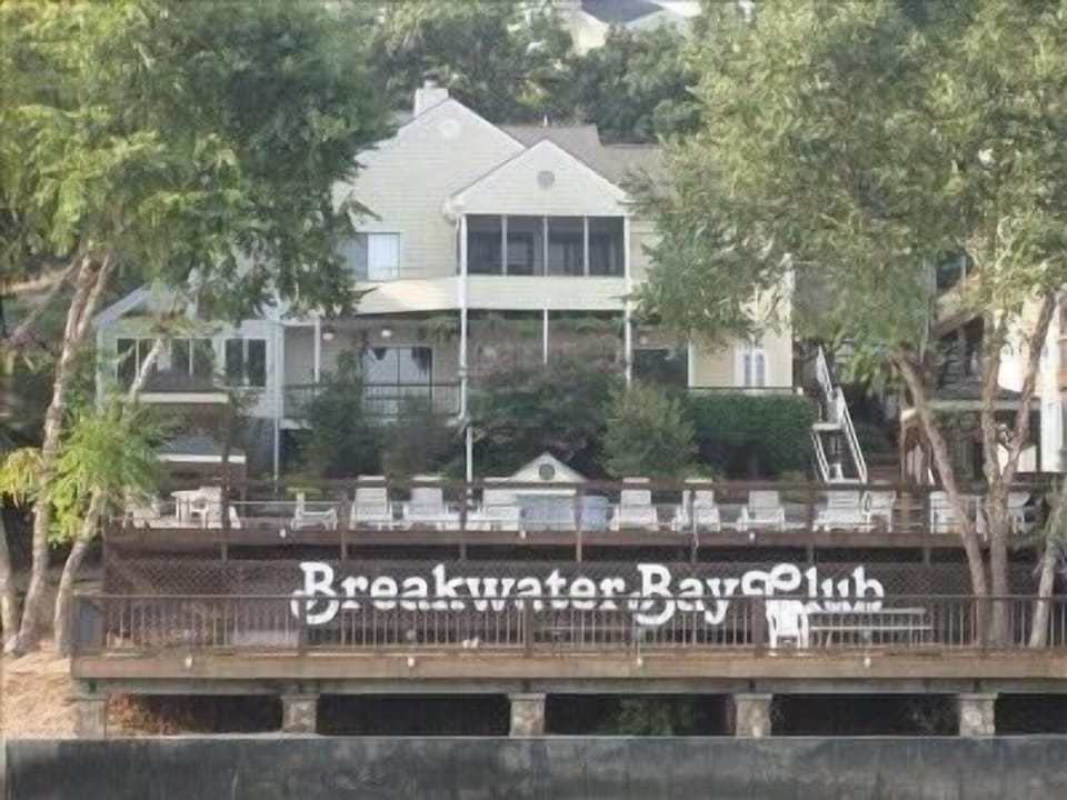 View from the water, of the lake front pool and picnic area below. 