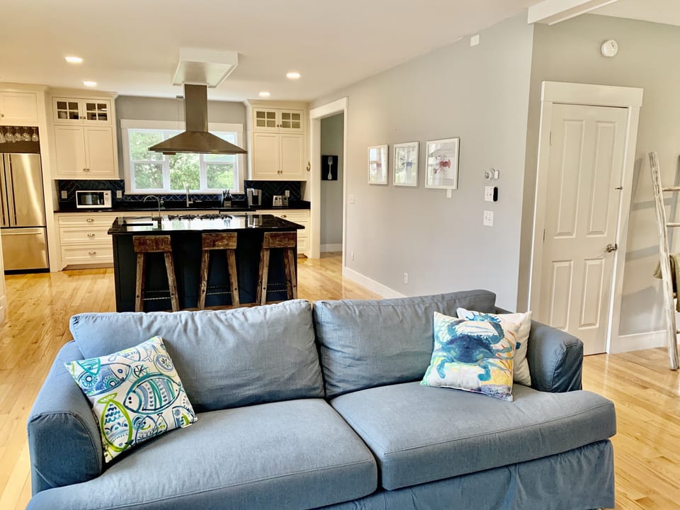 Talk to family and friends in the living room while cooking in the kitchen