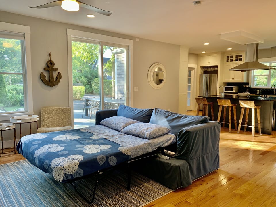 There is a queen size mattress on the hide-a-bed in the living room
