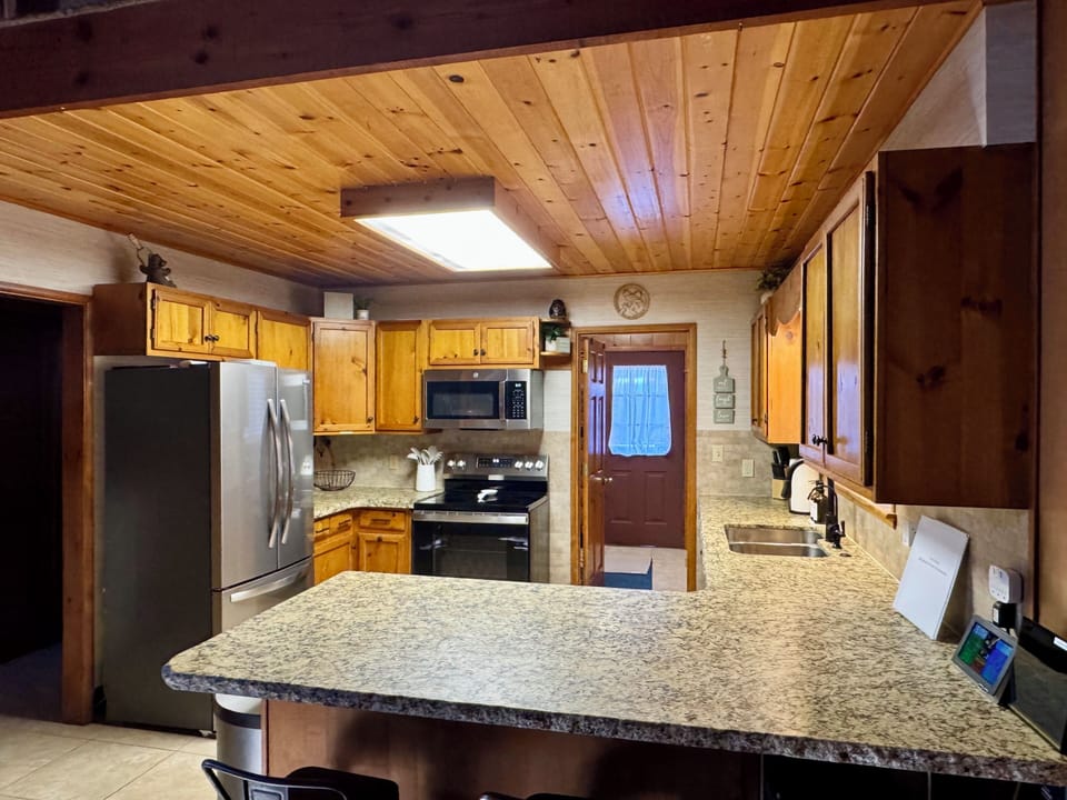 Kitchen has an island overlooking the Great Room and Dining Room.