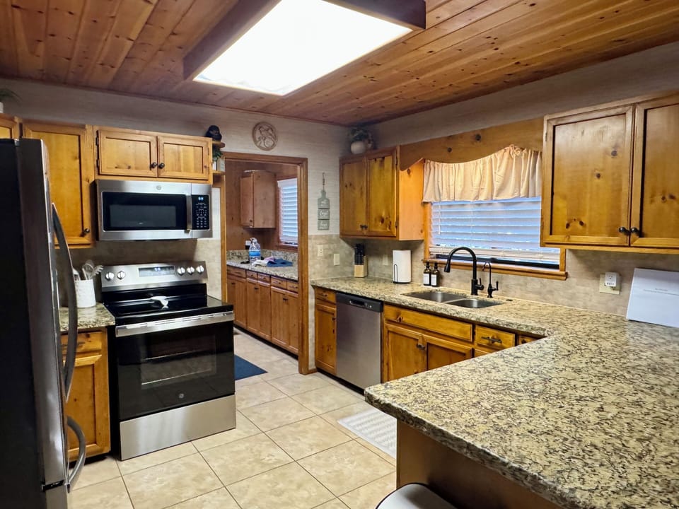 Warm and inviting fully stocked kitchen.