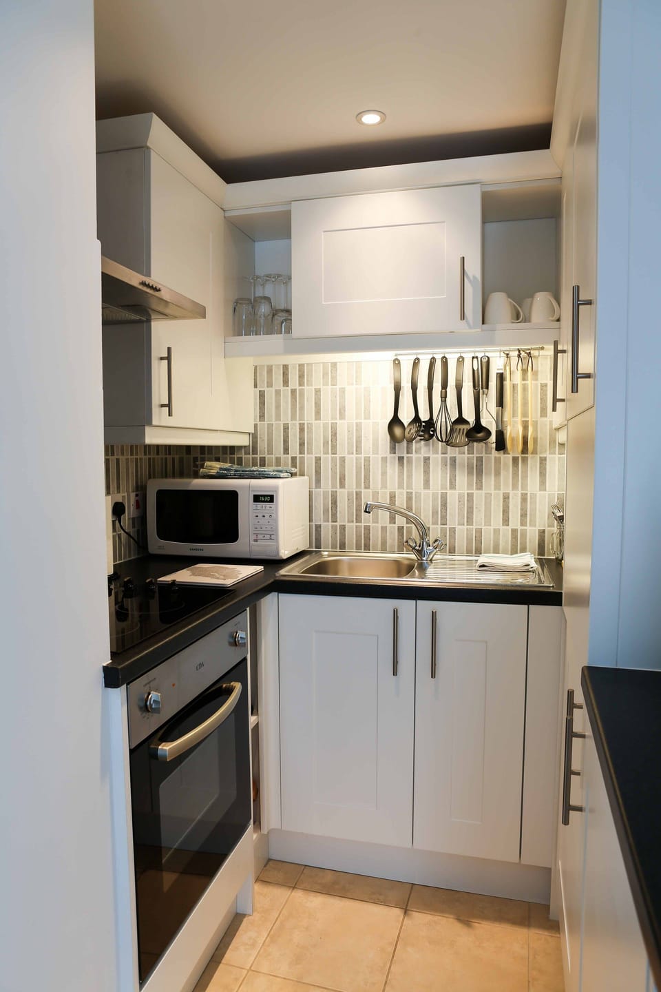 Compact with all you need.  A washing machine and fridge in here too!