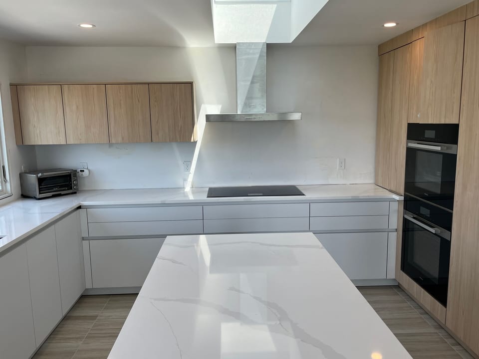 Top of the line appliances, including Thermador Freedom induction cooktop.