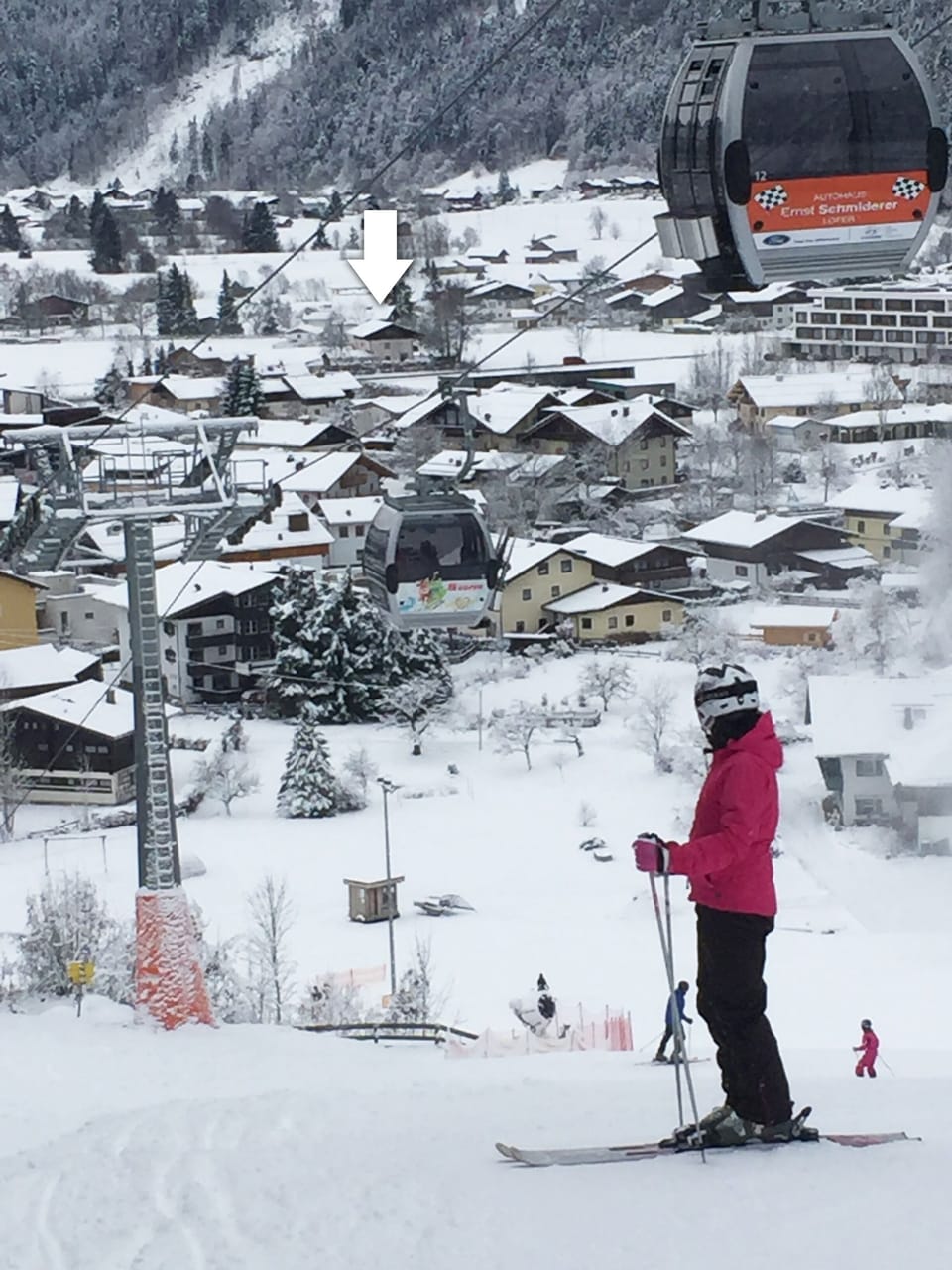 White arrow shows house's close proximity to the ski slopes