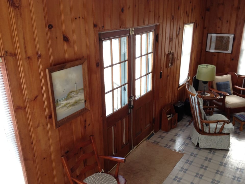 View from stairs of front of house and living area