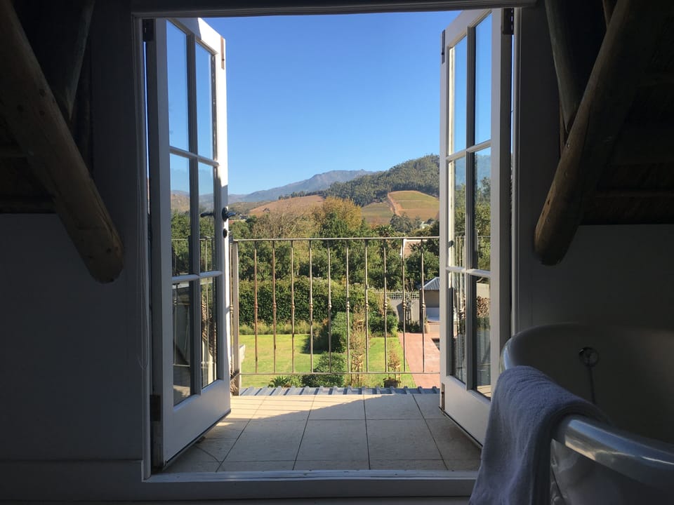 KOKO HOUSE FRANSCHHOEK, SOUTH SUITE BATHROOM/ VIEW