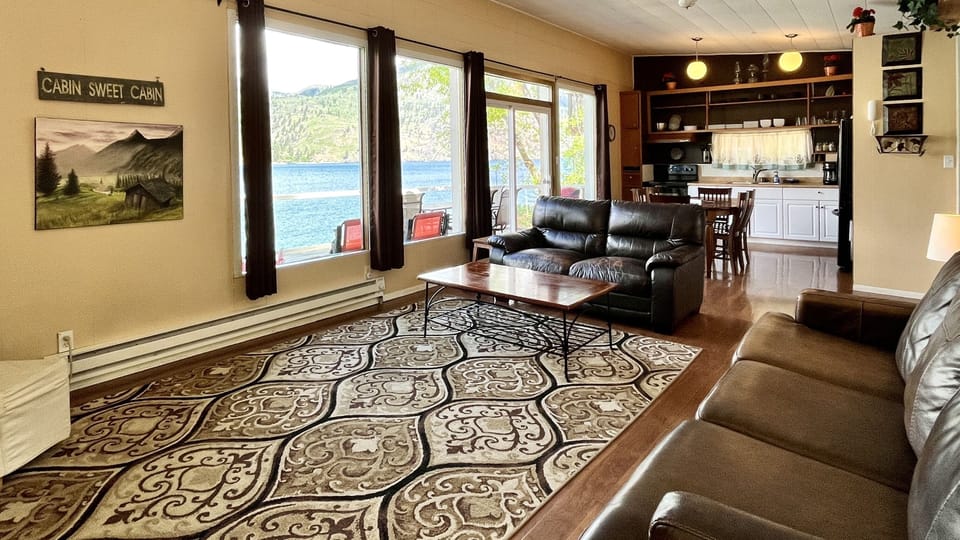 Open floor plan and wall of windows showing off the beautiful views