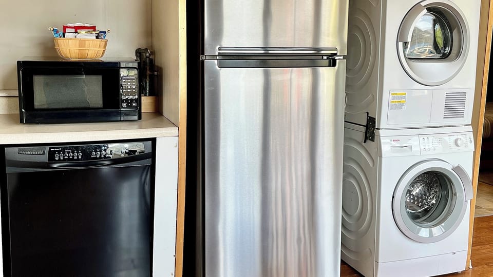 Kitchen - dishwasher, fridge, and laundry area