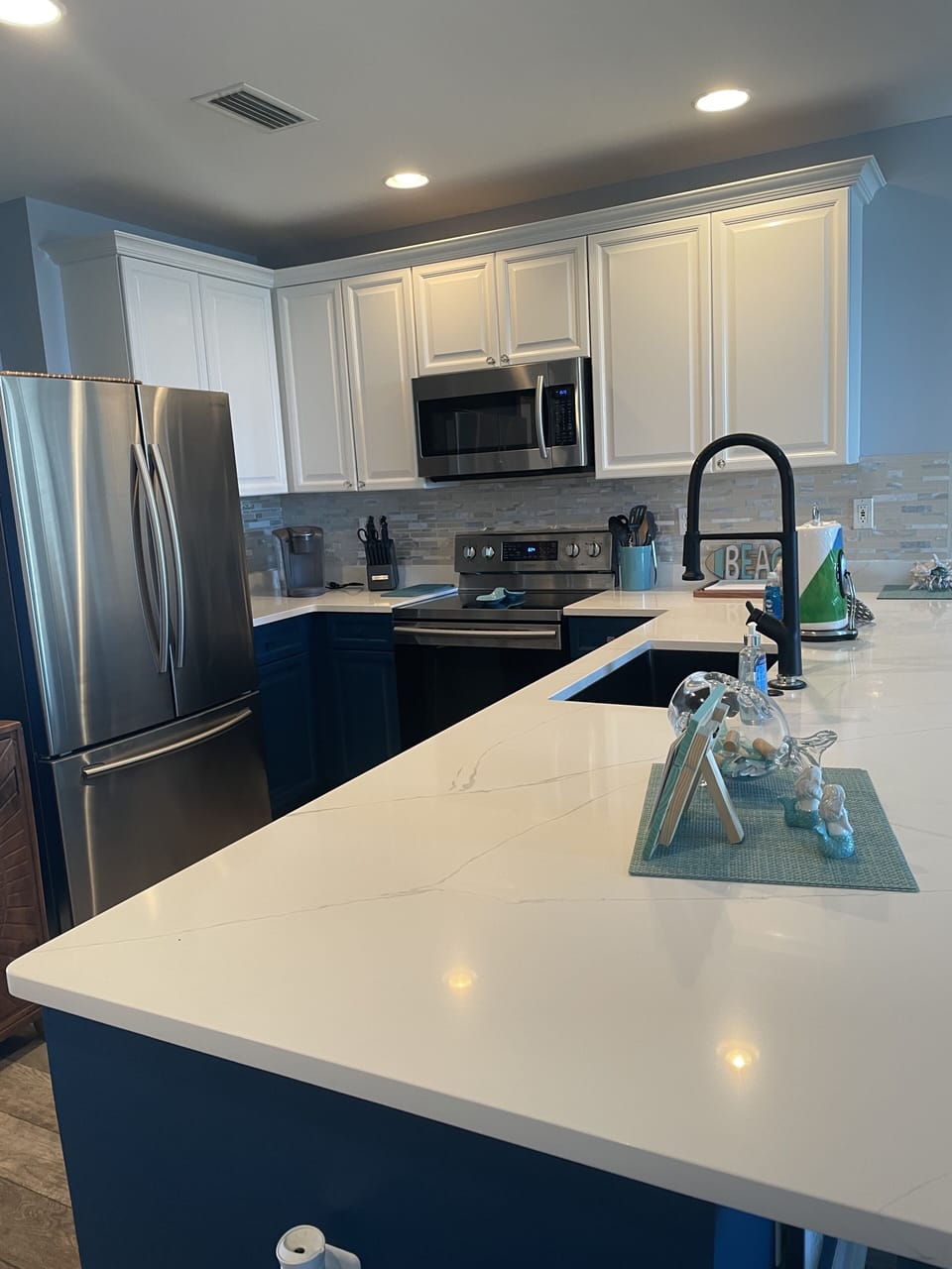 REFRESHED KITCHEN, NEW COUNTER TOPS/SINK AND PAINTED CABINETS. 