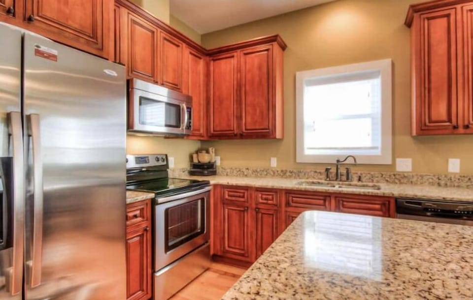 Kitchen is equipped with cookware, dish ware, kuerig and drip coffee maker. 