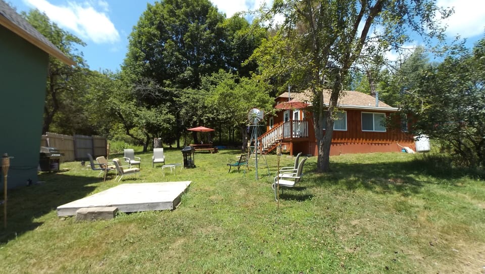view of cabin with other rental house at left