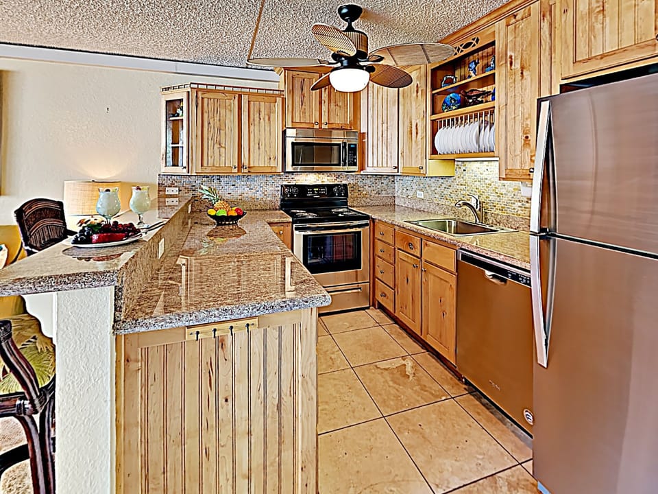 Kitchen - Enjoy serving your guests at the kitchen countertop with bar seating for two