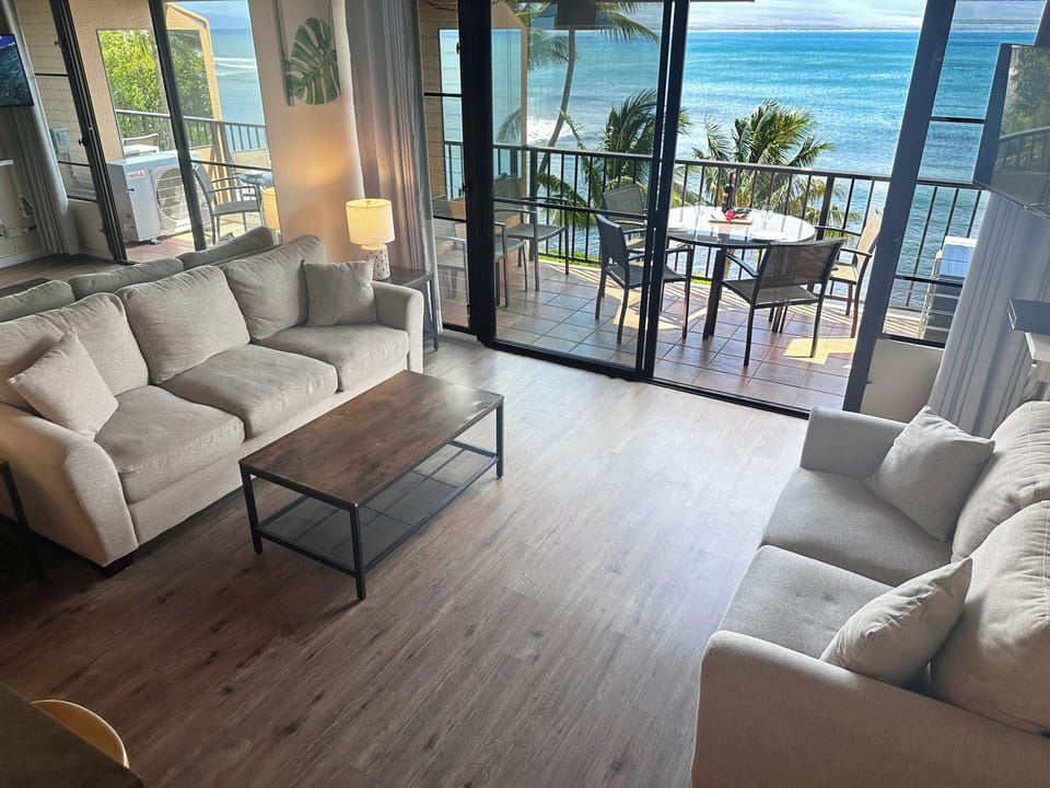 Chic and cozy comfort awaits you in the living room with a spectacular view of the ocean