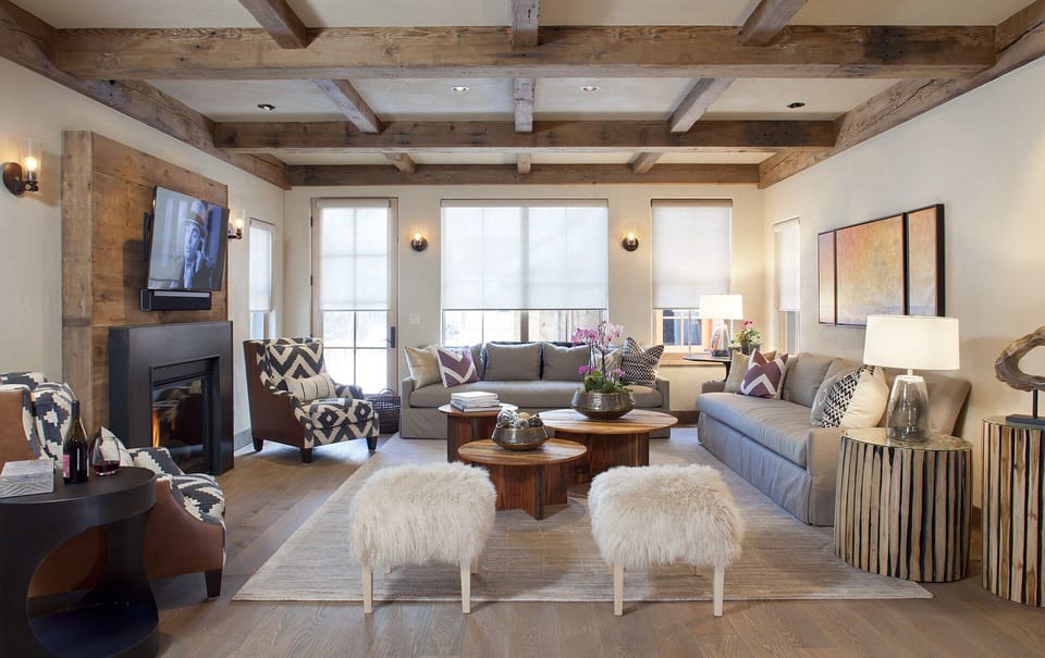 The living room opens to a large patio for outdoor dining and grilling.