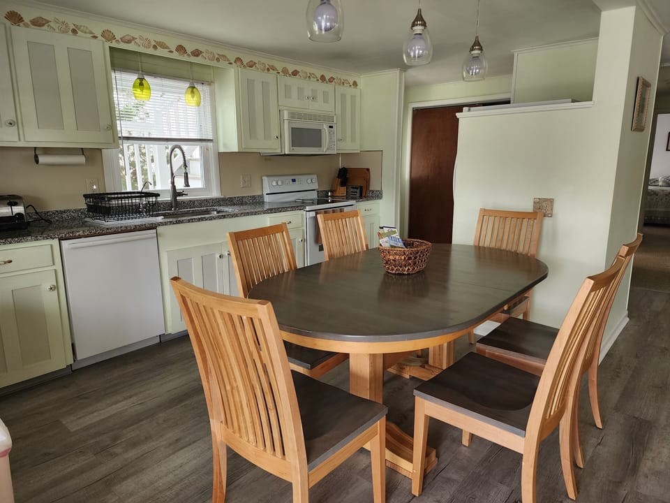Kitchen table (w leaf), dining chairs for 8,
updated appliances