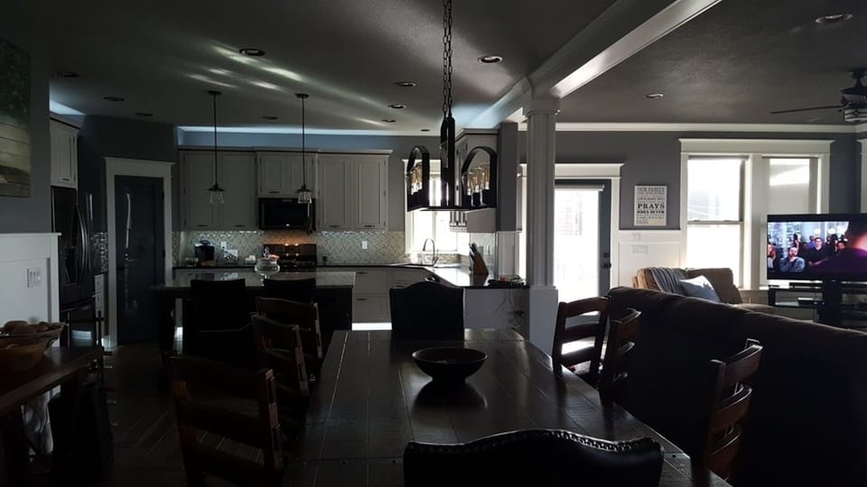 Dining and kitchen areas, view into living area