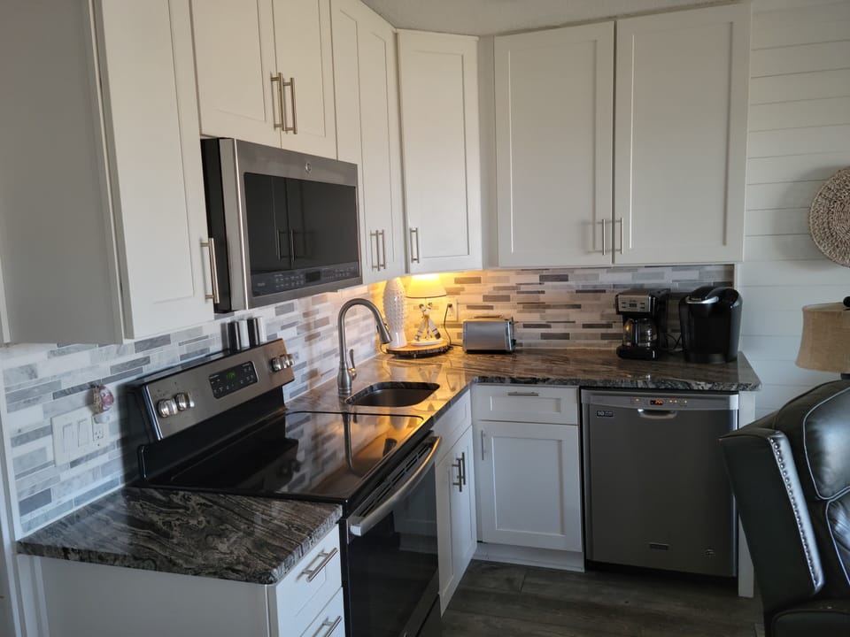 Dish washer, full size stove, microwave, Keurig and regular coffee maker