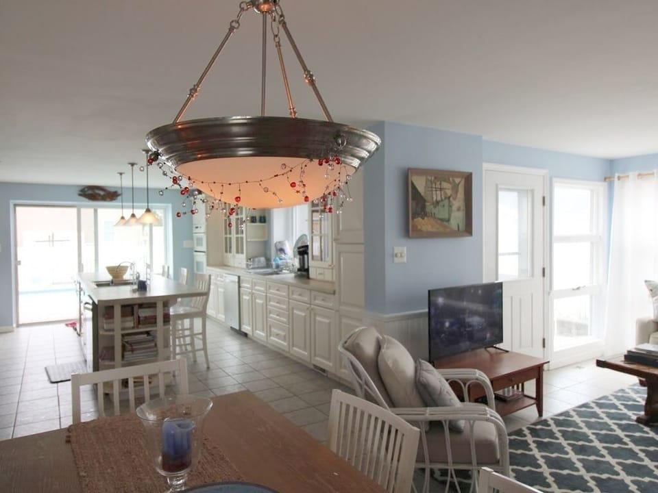 Great room with door leading to outside fenced in area