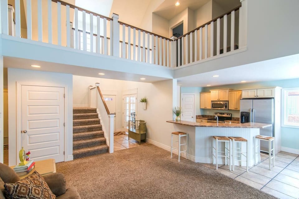 The bright kitchen opens up to the spacious family room.