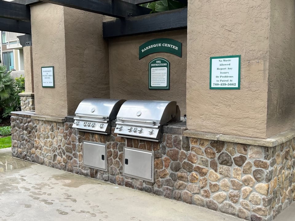 BBQ/Grilling terrace above the main pool. It  has picnic table seating for 12.