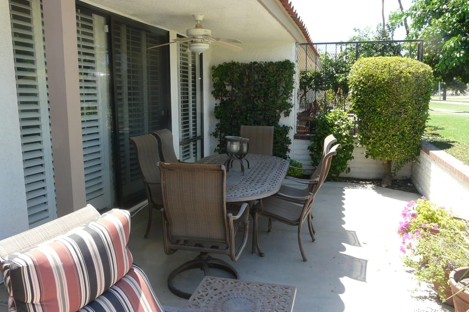Patio features iron table and chairs, lounge chairs, brand new BBQ.