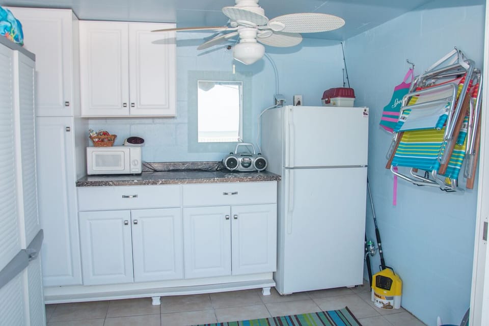 Pool toys, rafts, beach chairs, fishing gear, microwave and refrigerator.  