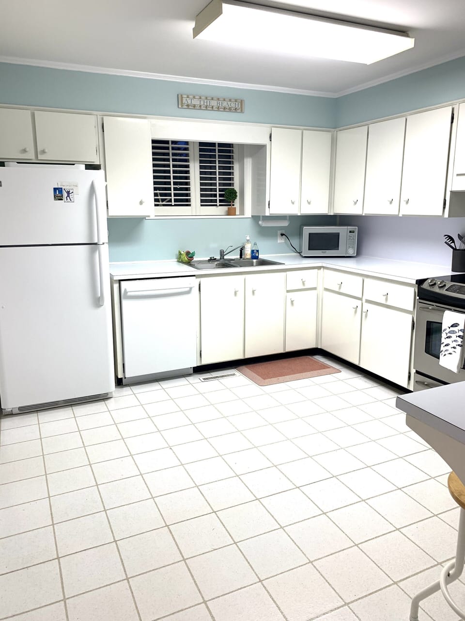 Freshly painted kitchen with brand new cookware, coffee maker and accessories.