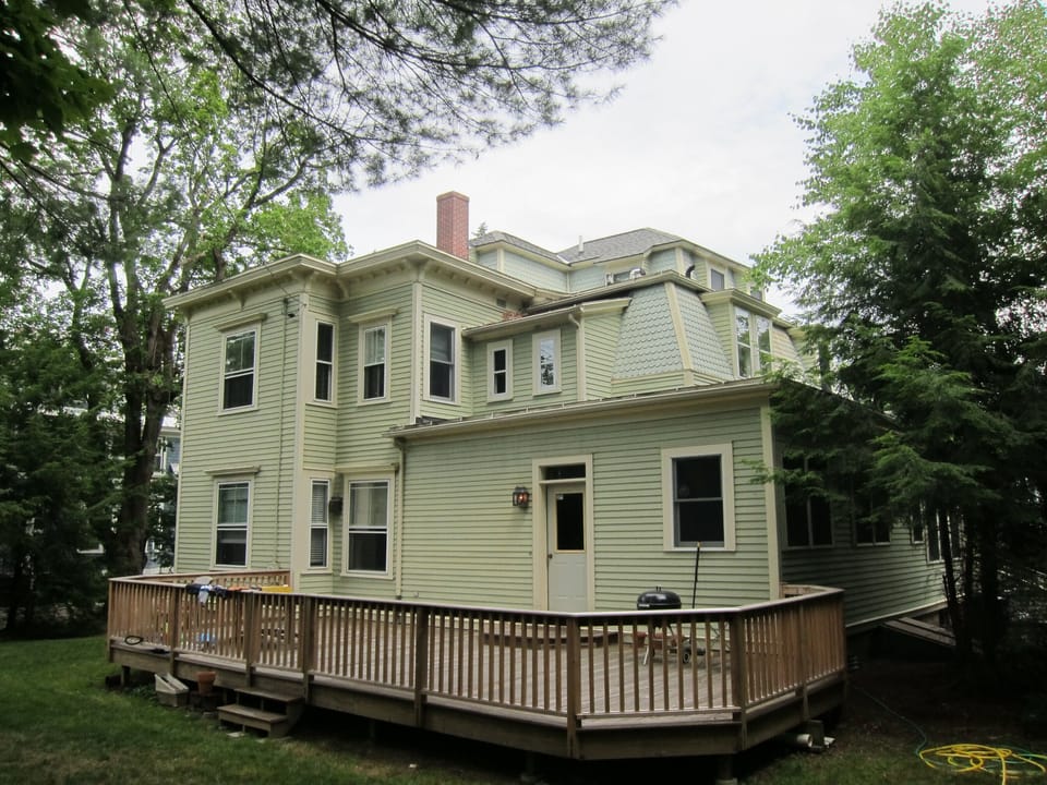 Rear deck with lots of seating and fully fenced yard