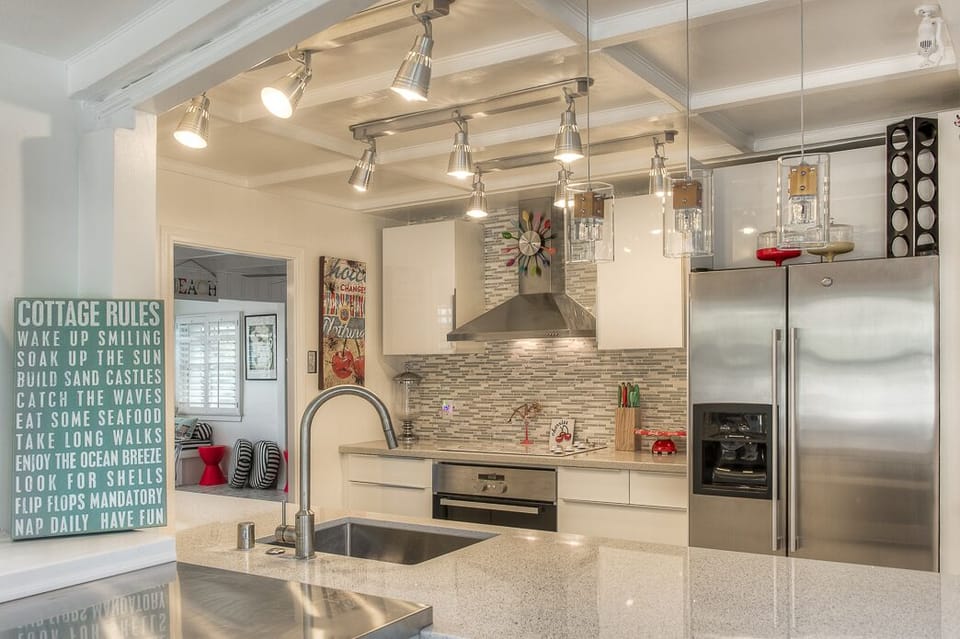 Completely new kitchen with microwave, oven, dishwasher,refrigerator with ice maker.  Quartz counter tops through out-stunning! Well stocked with pots, pans, dishes etc. Everything to make you feel at home.