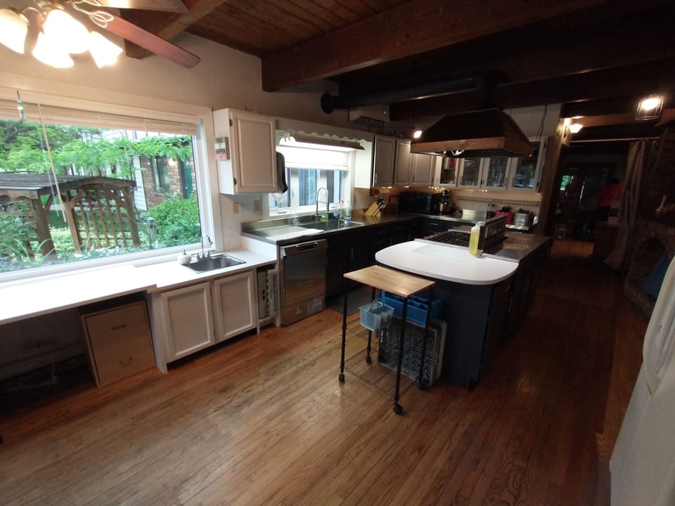 Main Kitchen: Double oven, 2 fridges, freezer, 2 sinks, microwave, cookware