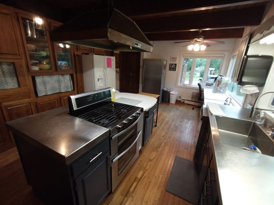 Main Kitchen: Double oven, 2 fridges, freezer, 2 sinks, microwave, cookware