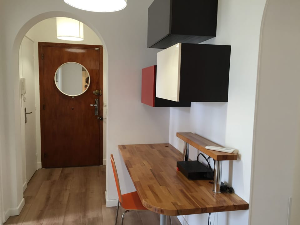 Welcoming foyer with a cheerful laptop workspace