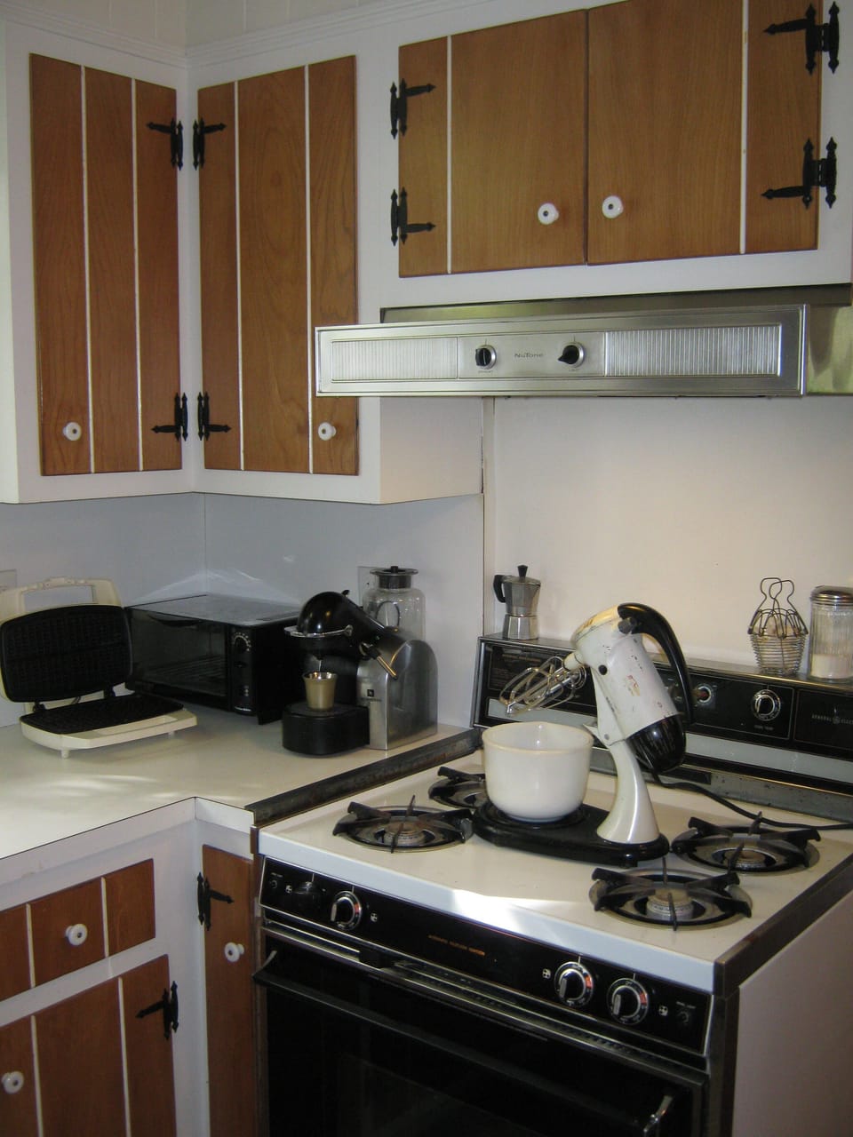 Making Breakfast in the Kitchen. Appliances shown are accessible and functional.