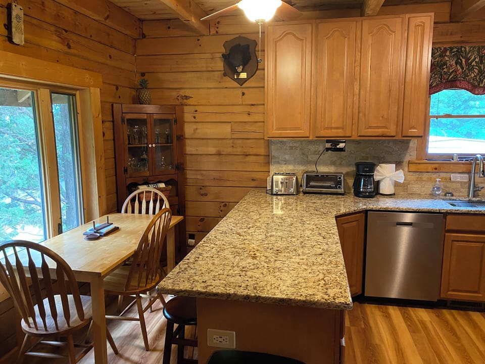 New Granite countertops in 2025 and new flooring, bar stools at counter