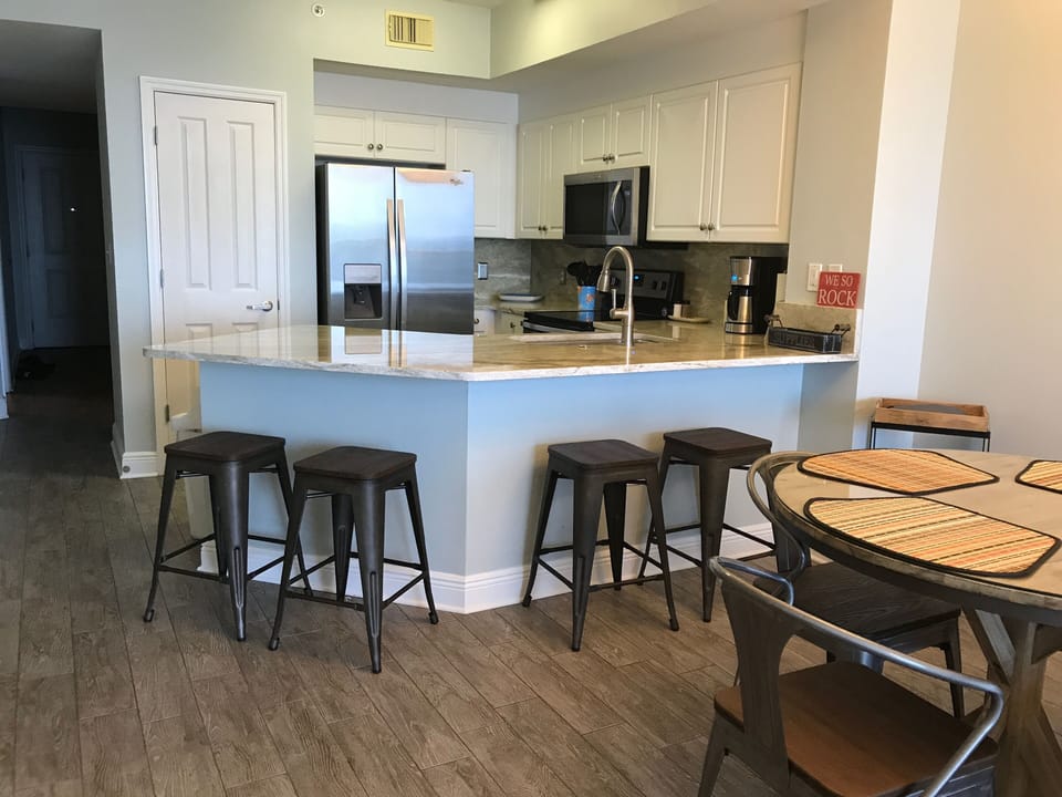 New granite countertop and stainless steel appliances