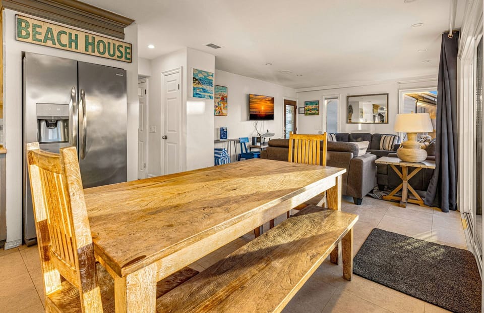 The kitchen opens out to the dining area, and front deck, for easy cookouts, game nights, you name it!
                