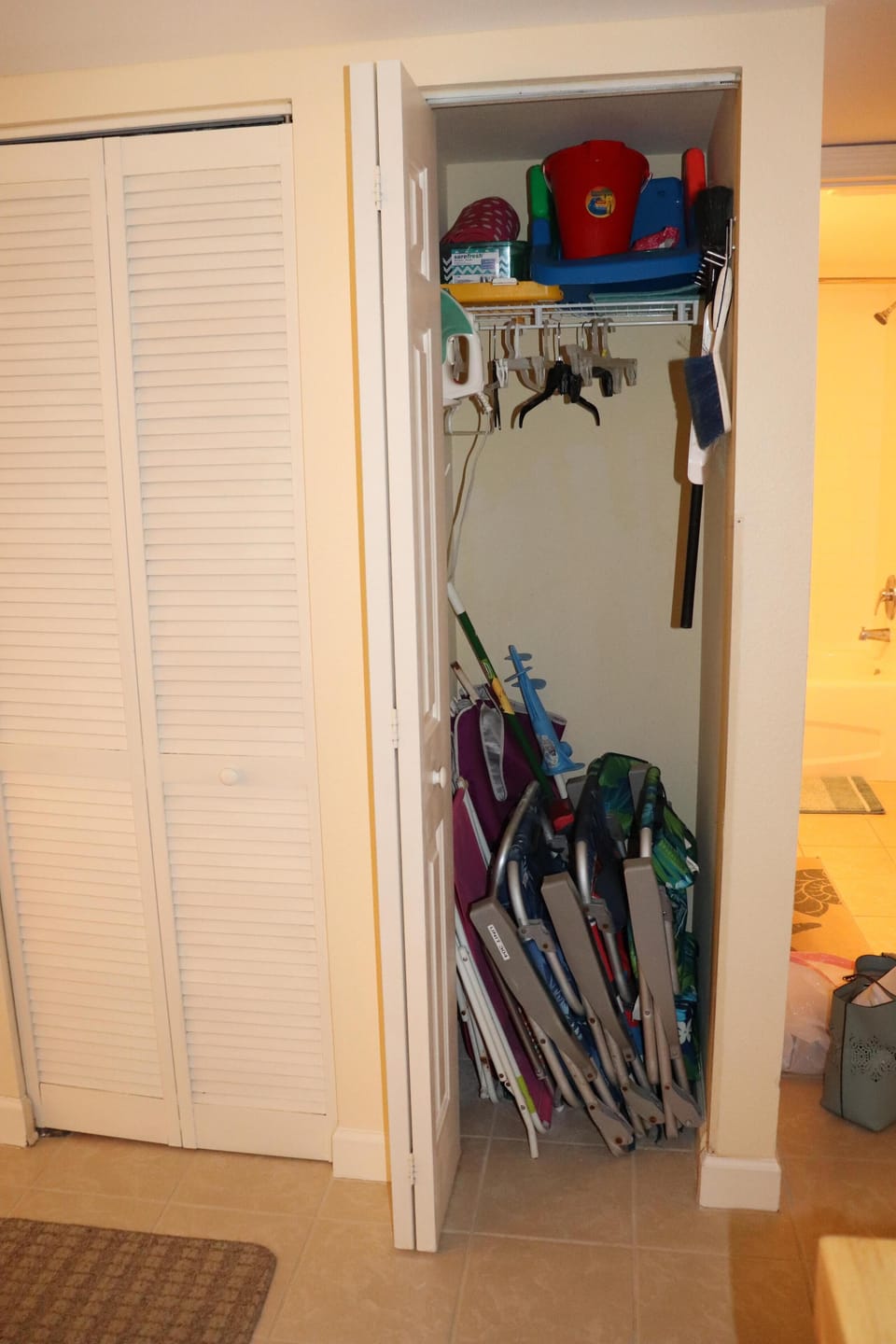 Hall closet has at least 2 beach chairs and likely 4 chairs for guests to use.