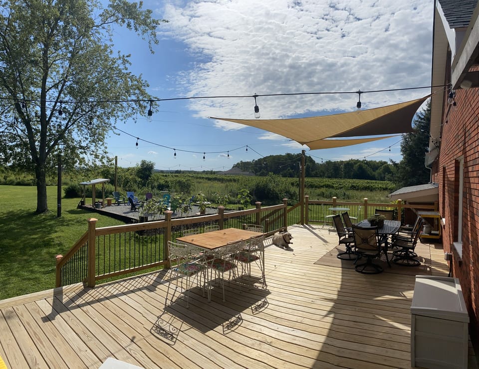 Wrap around back deck with seating for 14.