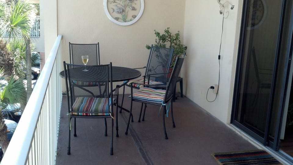 Balcony dining area 
watch for dolphins and manatees!