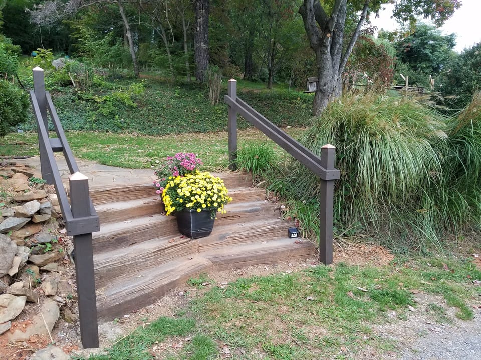 Steps from the parking area to the front lawn
