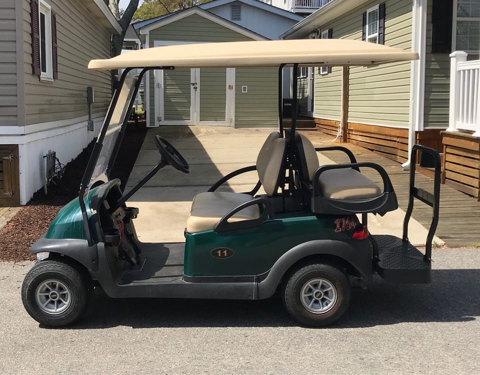 Courtesy Golf Cart with long roof and rear seat