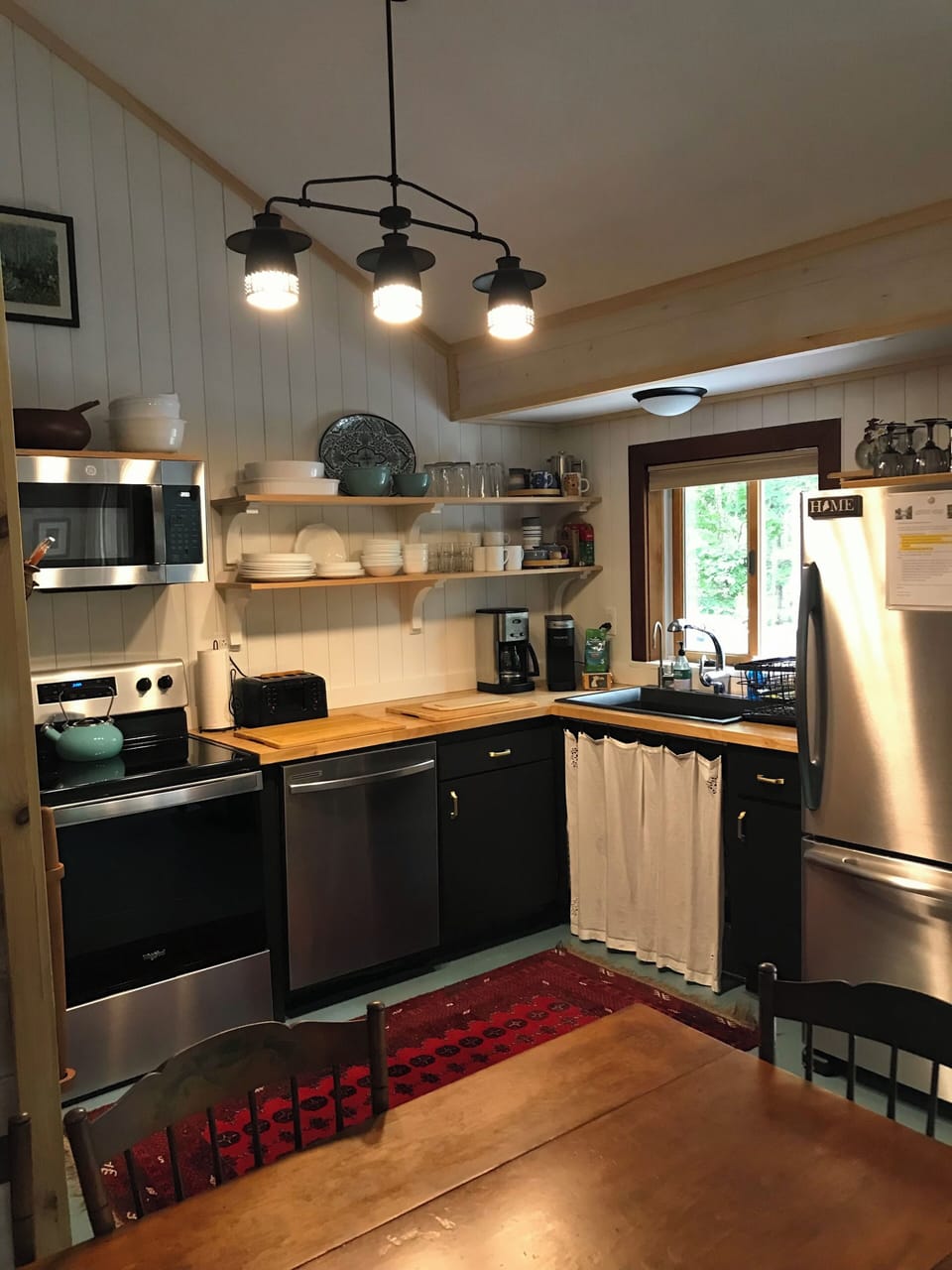 Full size fridge. Enjoy meals around the farmhouse table seating 6-8 comfortably