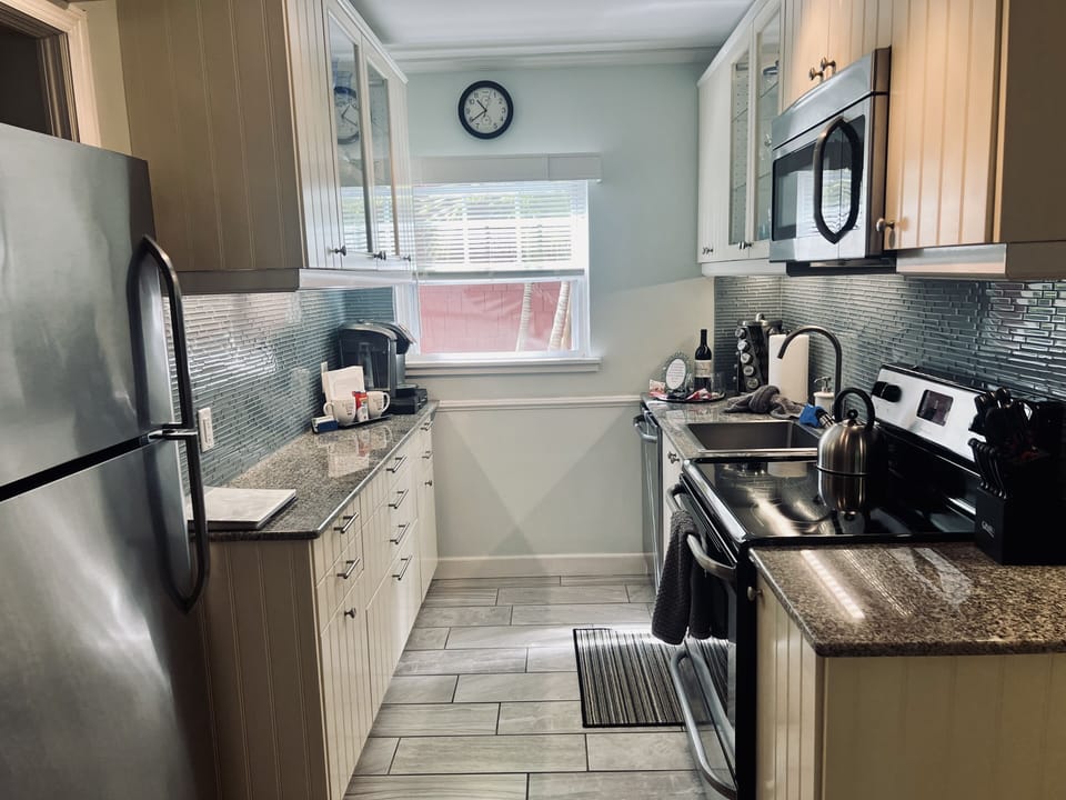 A well lit kitchen with daylight or task lighting. Bon Appetit.