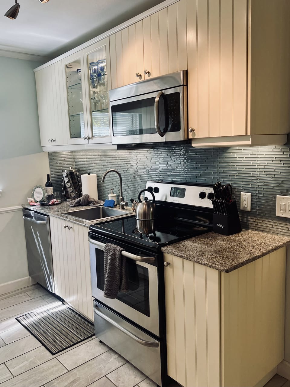 Slow closing and quiet cream colored cabinets. 